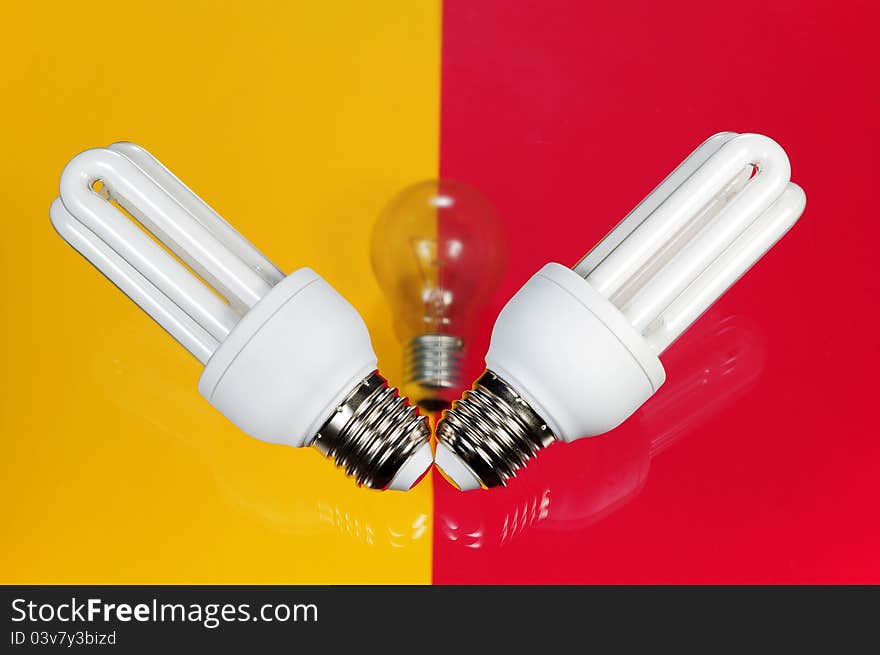 Light bulb on on colorful background