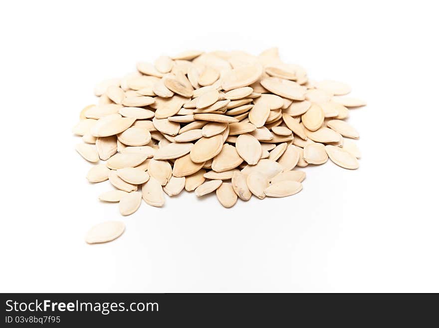 Pumpkin seeds isolated on white background.