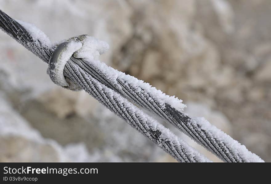 Detail of iron rope covered with ice or snow. Detail of iron rope covered with ice or snow