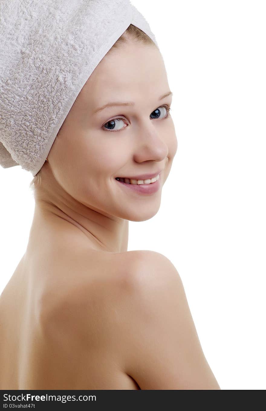 Beautiful  girl in a towel on a white background