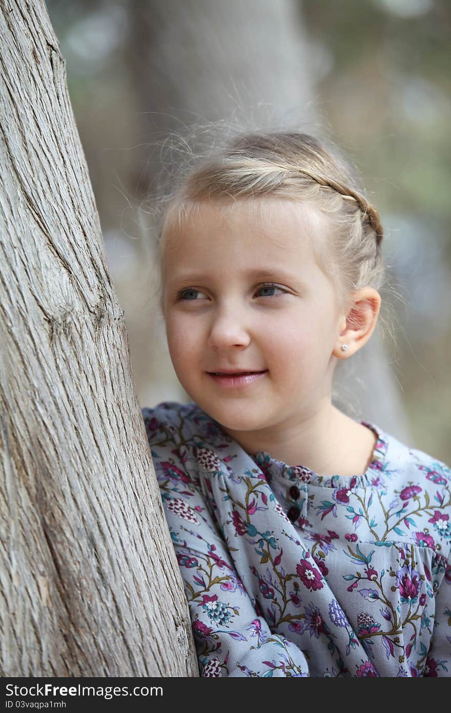 Portrait Of A Girl Near A Tree