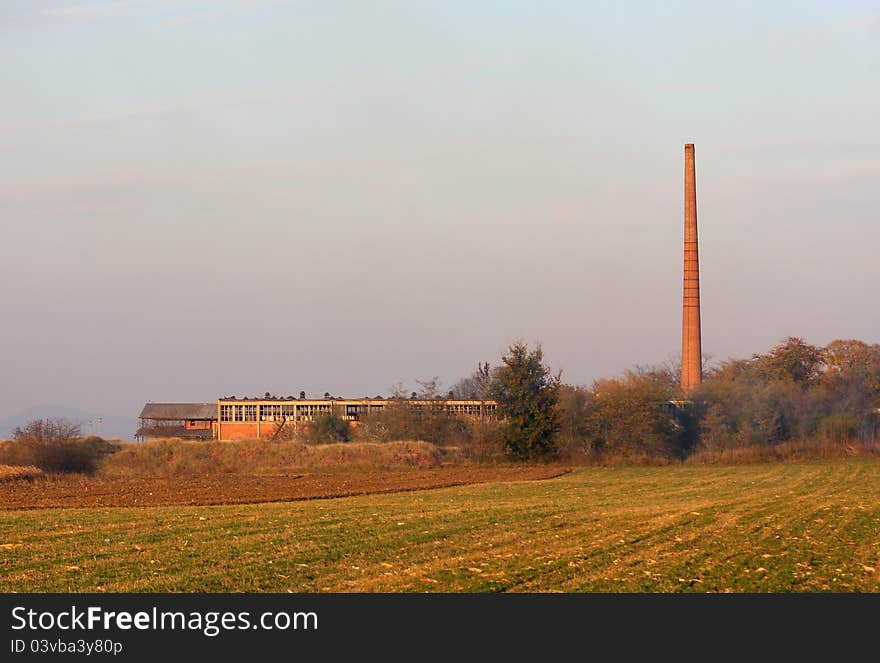 Abandoned old factory in the field. Abandoned old factory in the field