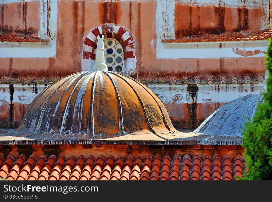 A close up of terracotta tiles on a byzantine mosque roof in greece