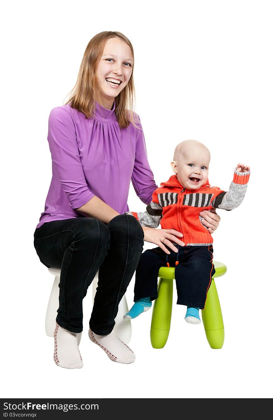 Mother and son in a chair in the studio isolated on white background