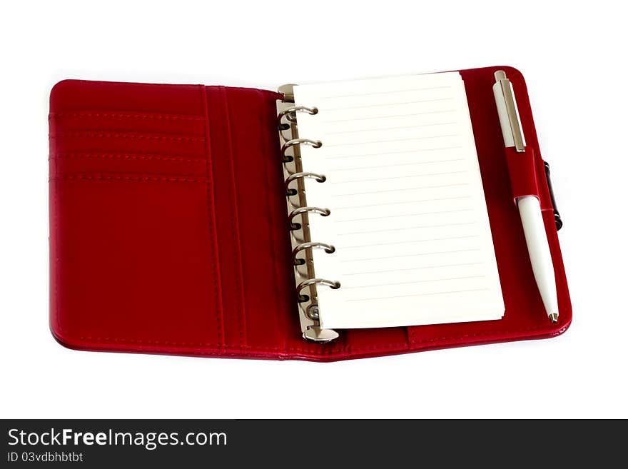 Red Notebook And A Pen With White Paper.