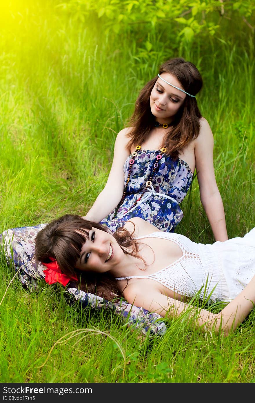 Pretty young girls on the meadow