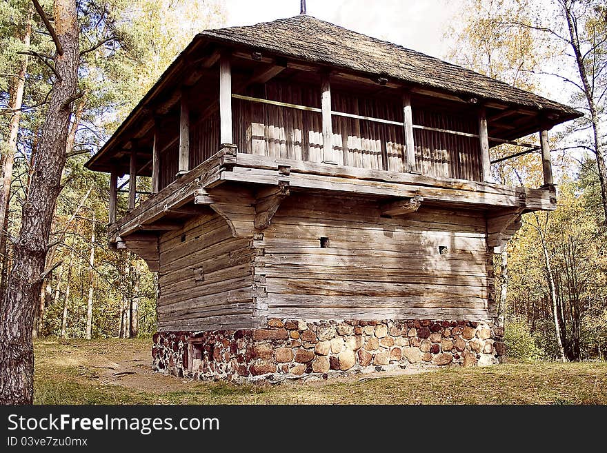 Farmhouse with straw roof on a stone foundation in Latvian Ethnographic museum under opened founded sky in 1924 and 97 ga occupies territory ashore lake Yugla farmsteads of peasants, fishermen, workshops of artisans from all ethnographic districts to Latvia, which are built in a period from 16th. Farmhouse with straw roof on a stone foundation in Latvian Ethnographic museum under opened founded sky in 1924 and 97 ga occupies territory ashore lake Yugla farmsteads of peasants, fishermen, workshops of artisans from all ethnographic districts to Latvia, which are built in a period from 16th