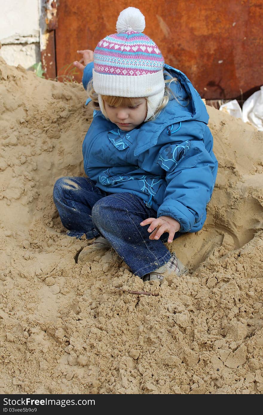 A child jumping from the sand hills. A child jumping from the sand hills