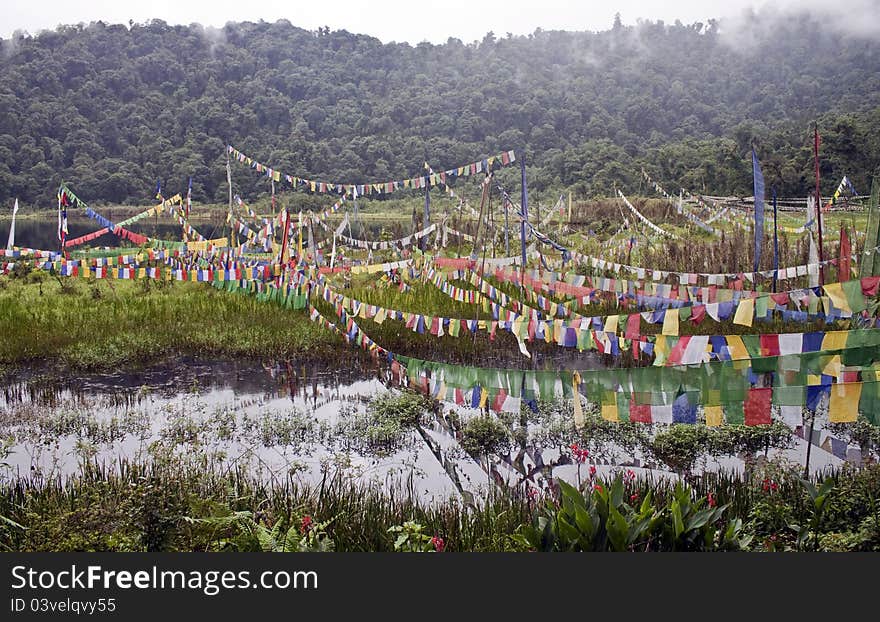 Buddhist flags at sacred lake in Sikkim, India