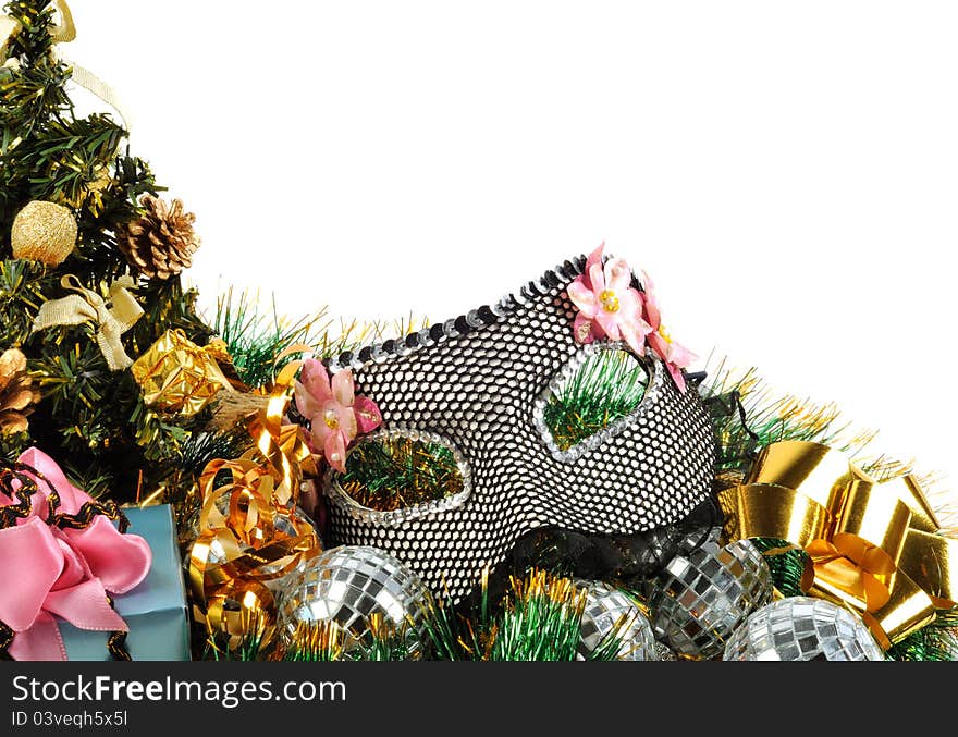 Christmas  decoration with tree gifts and carnival black mask on a white background. Christmas  decoration with tree gifts and carnival black mask on a white background