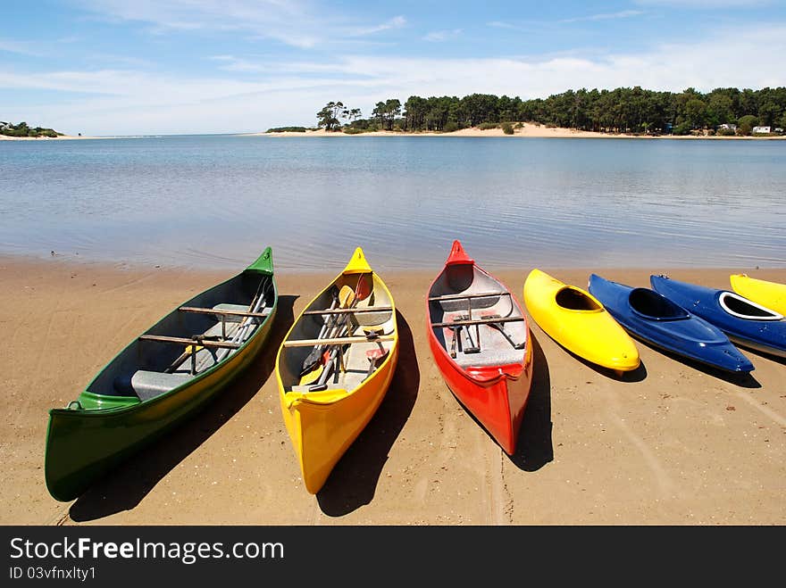 Colorful canoes by the water