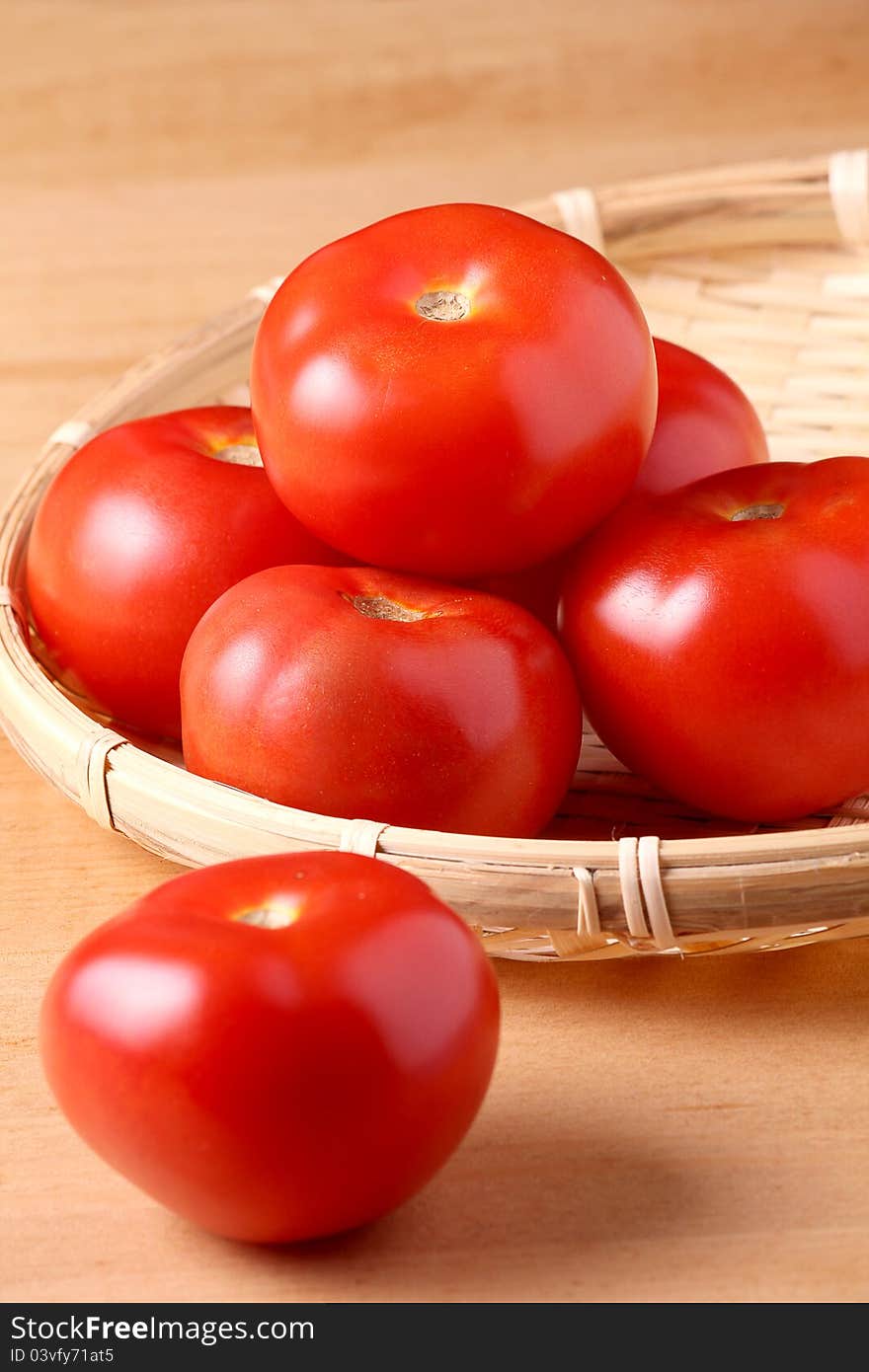 Fresh tomato on wooden table top