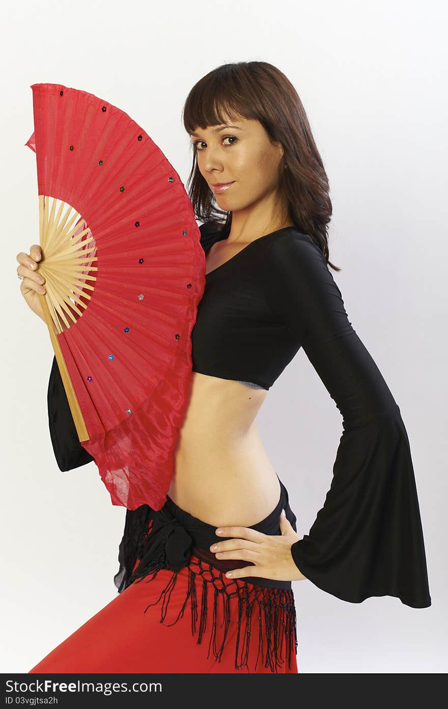 Flamanco dancer in black and red dress with fan. Flamanco dancer in black and red dress with fan