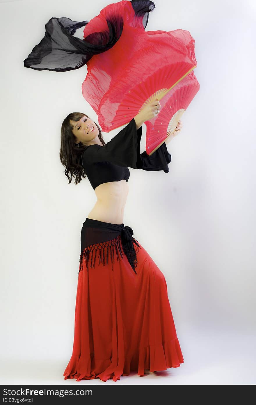 Flamanco dancer in black and red dress with fan. Flamanco dancer in black and red dress with fan