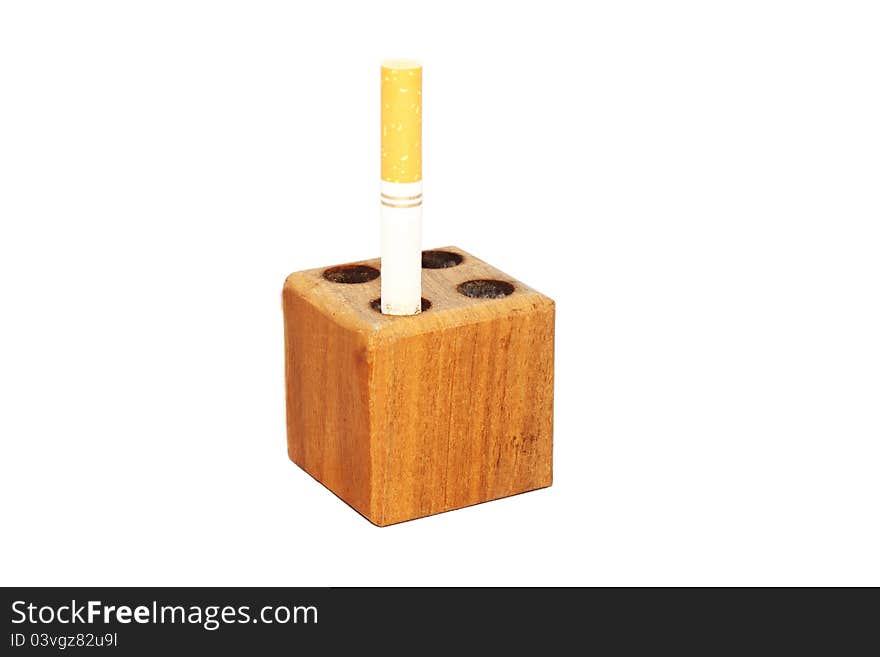 Partially smoked cigarette in a snuff block to symbolize quit smoking. Partially smoked cigarette in a snuff block to symbolize quit smoking.