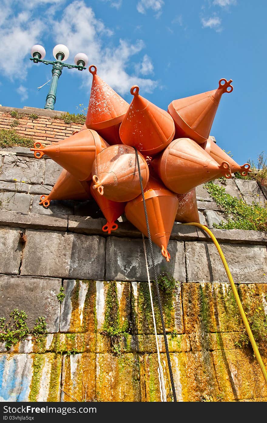 A group of mooring buoy next to the harbour in Napoli, Italy