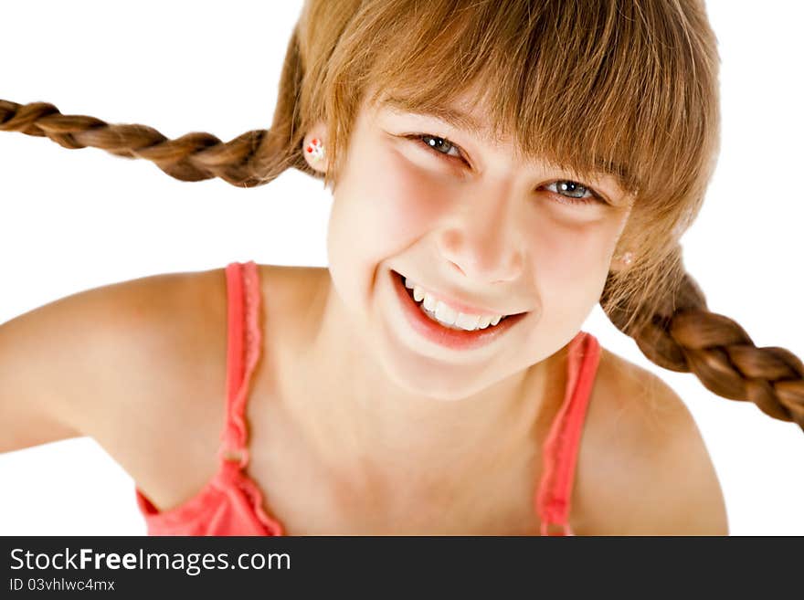 Portrait of sweet little redhead girl with braids, looking at camera and smiling. Portrait of sweet little redhead girl with braids, looking at camera and smiling