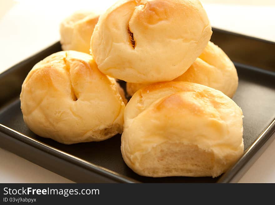 Bread with dried shredded pork and chilli sauce on dish