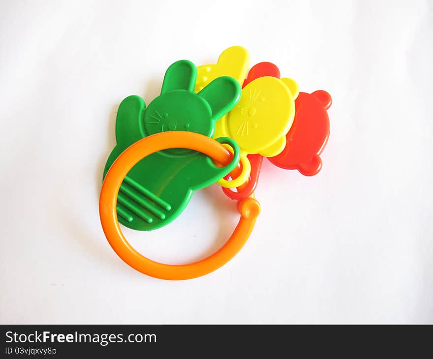 A plastic toy rattle on white background.