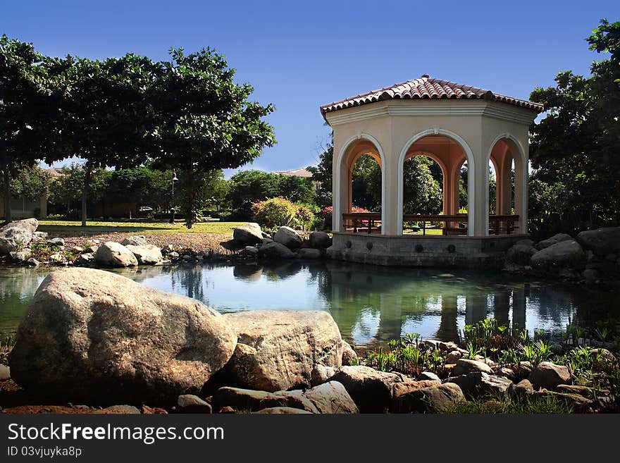 Beautiful garden with stones and small lake