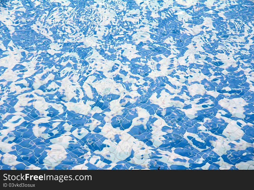 White and blue abstract shapes in swirling water. White and blue abstract shapes in swirling water