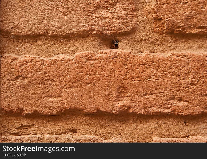 Old brick brown wall is closeup