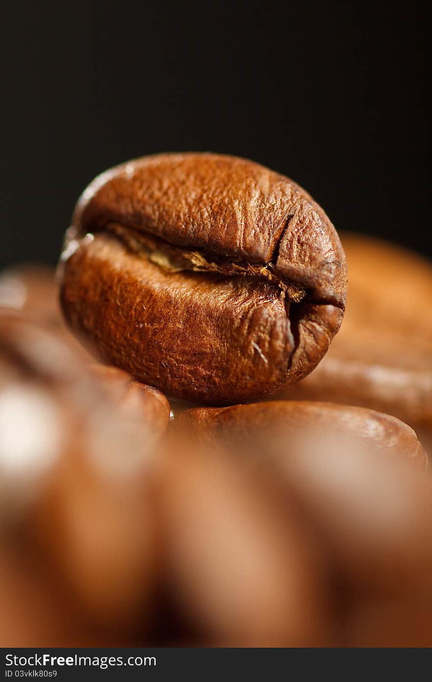 Coffee beans, photographed in black background. Coffee beans, photographed in black background