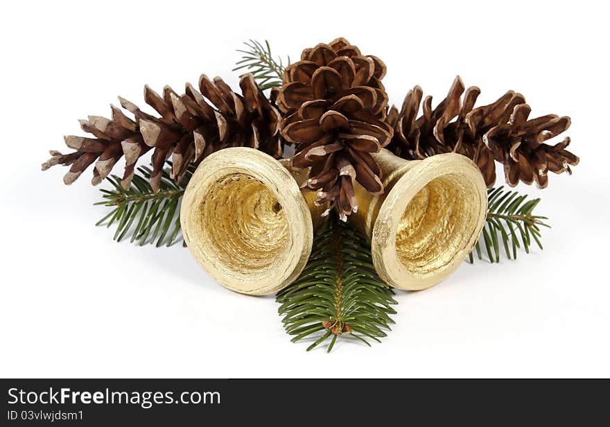 Pine cones and golden bells on the white background. Pine cones and golden bells on the white background