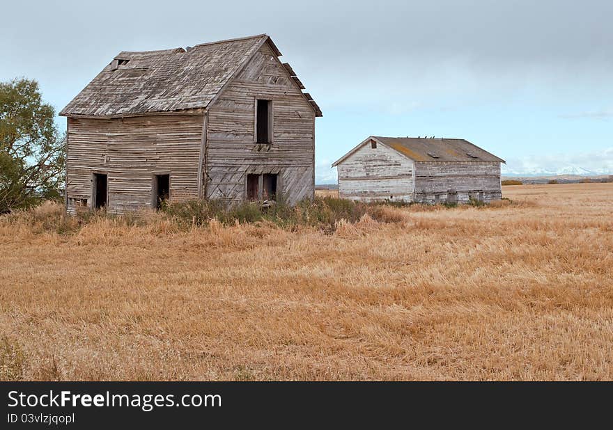 Historic farm house and building on priaire farm land by Calgary, Alberta, Canada. Historic farm house and building on priaire farm land by Calgary, Alberta, Canada