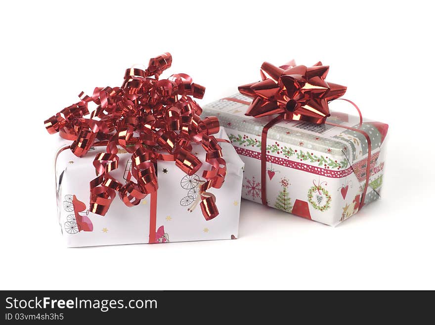 Christmas gifts in paper and with a red bow. Christmas gifts in paper and with a red bow