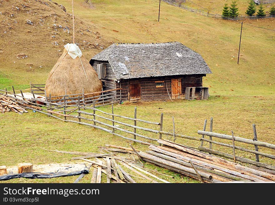 Generic transylvania rural household with old house and haycock. Generic transylvania rural household with old house and haycock