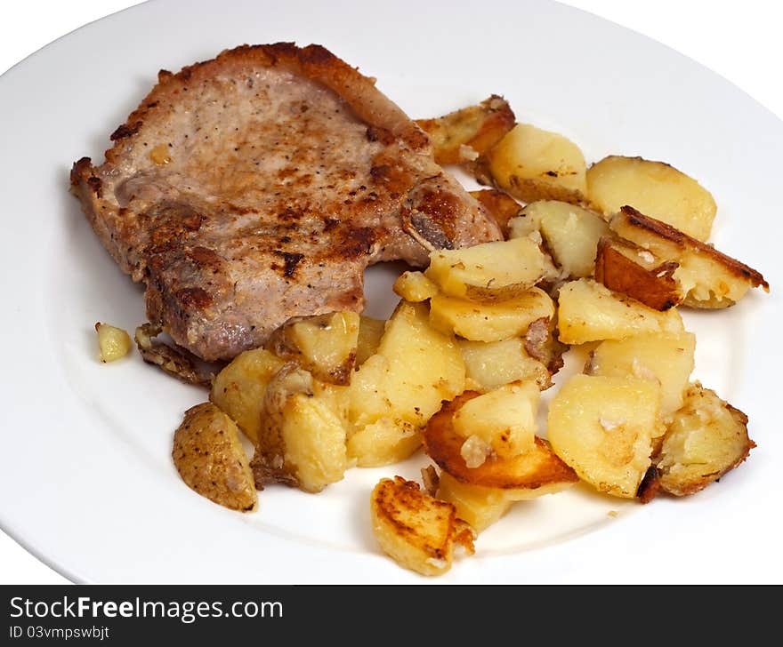 Plate with pork chop and potato on white background. Plate with pork chop and potato on white background