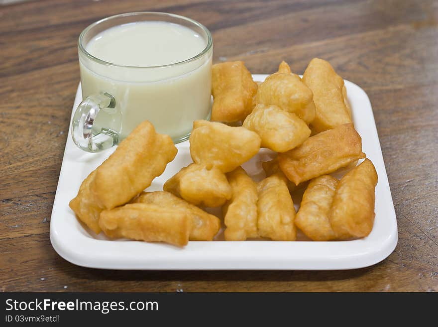 Deep fried dough sticks and a cup of soybean milk