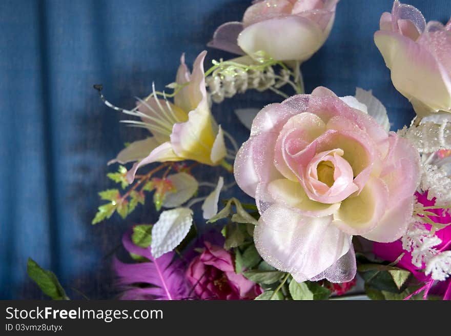 Fake flowers and pink roses made of fabric for decoration. Fake flowers and pink roses made of fabric for decoration