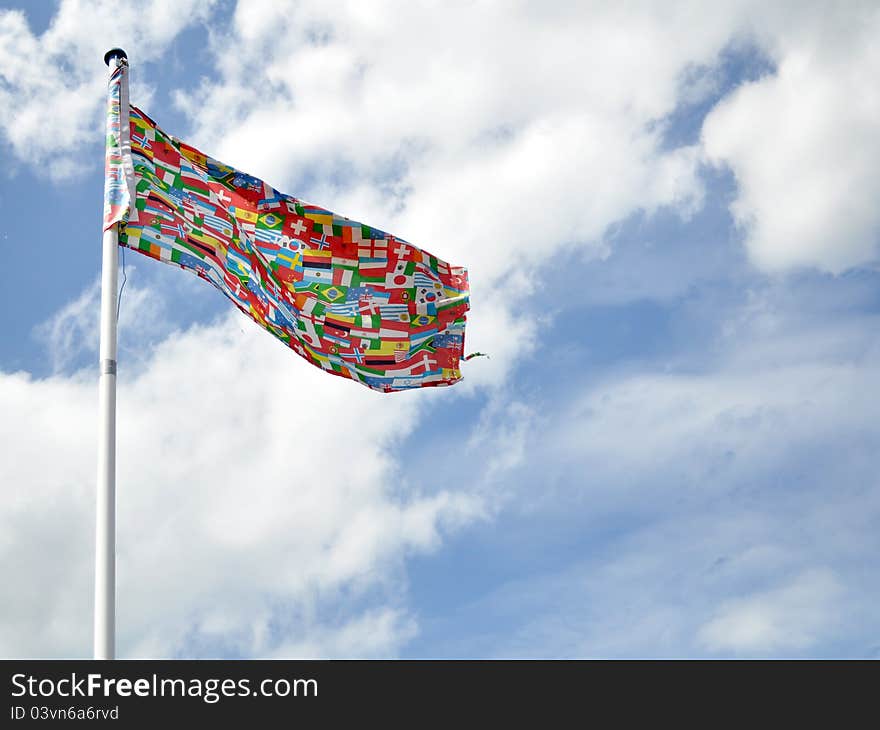 A Flag in front of a cloudy sky