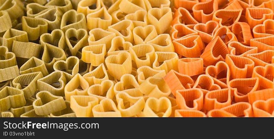 Italian flag made from colored pasta in shape of heart. Italian flag made from colored pasta in shape of heart