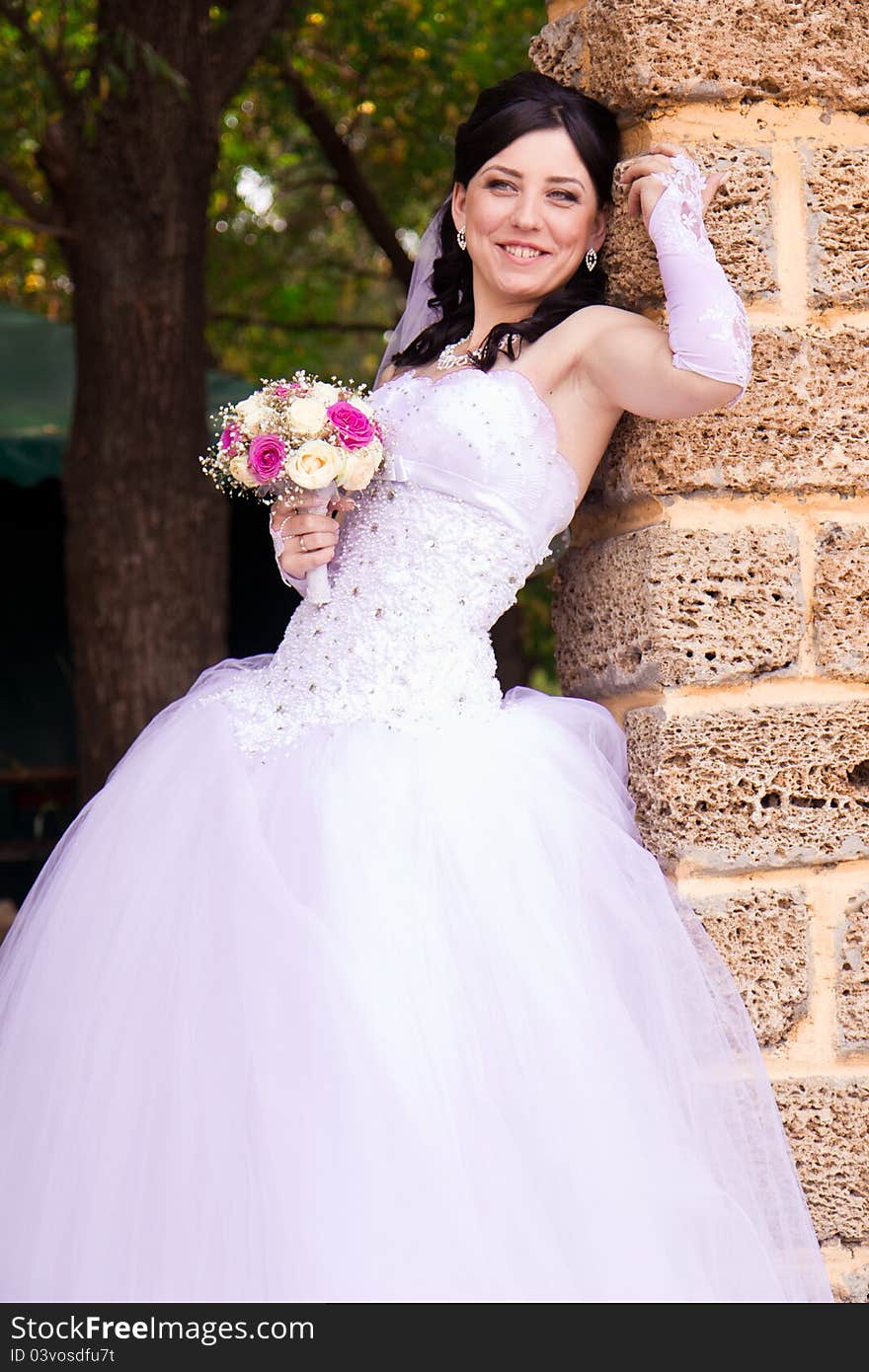 Portrait of a beautiful happy bride outdoor