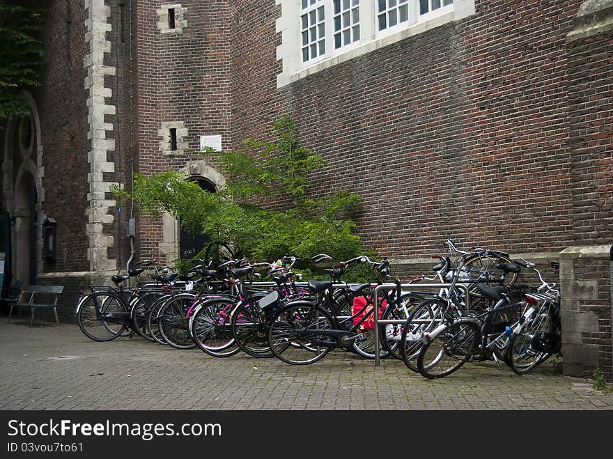 Amsterdam bicycles near an old building. Amsterdam bicycles near an old building