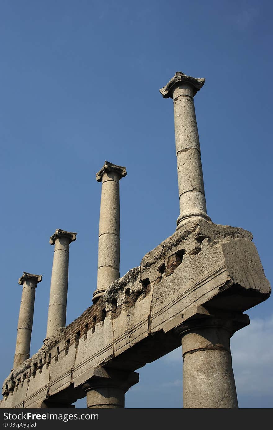 An image of a group of columns in the ruins of Pompei, Italy. An image of a group of columns in the ruins of Pompei, Italy