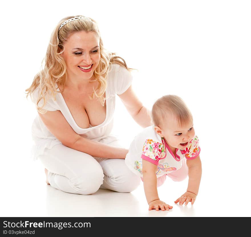 Child and loving mother; child steps on her hands. Child and loving mother; child steps on her hands