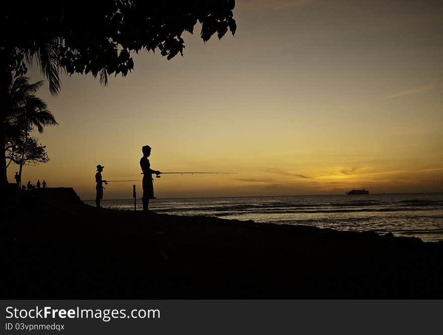 Sunset fishing at Ala Moana Beach Park