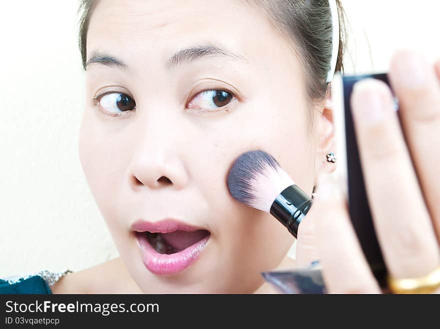 Close up Asian young woman make up.