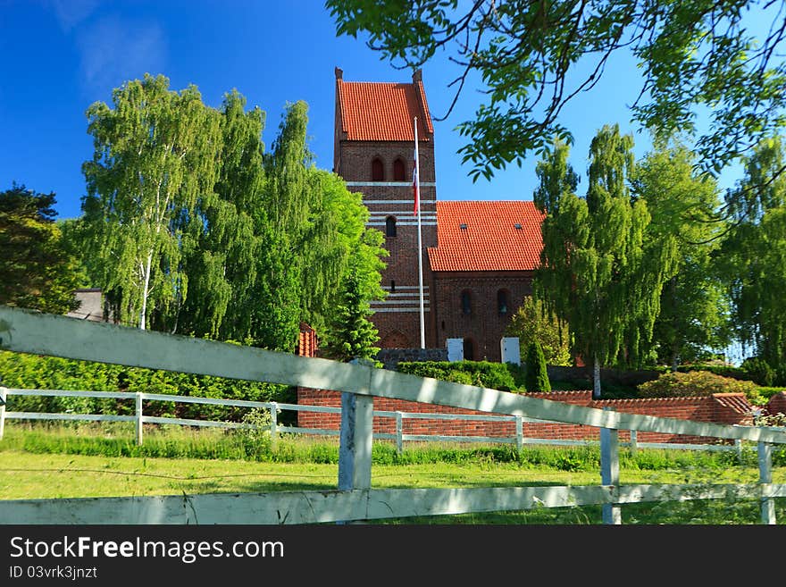 Traditional church surrounded by trees in Denmark. Traditional church surrounded by trees in Denmark