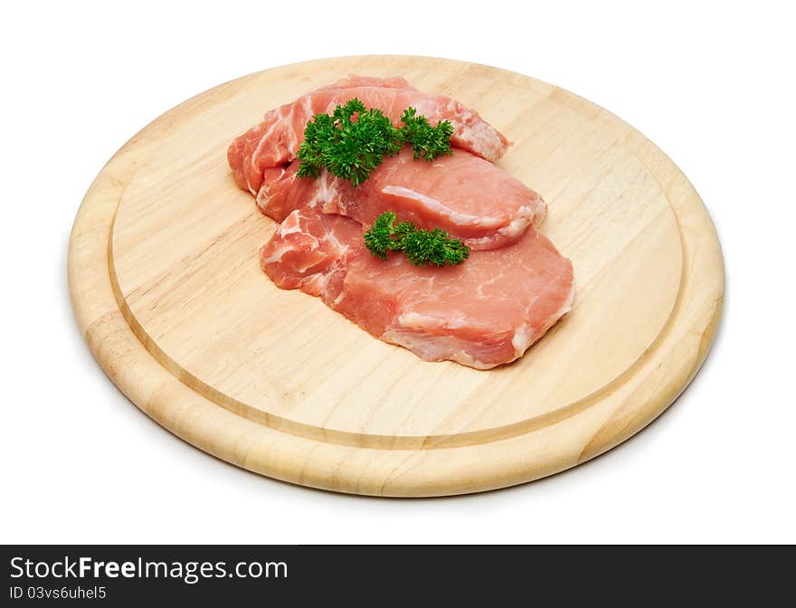 Fresh raw pork steak meat on wooden board.