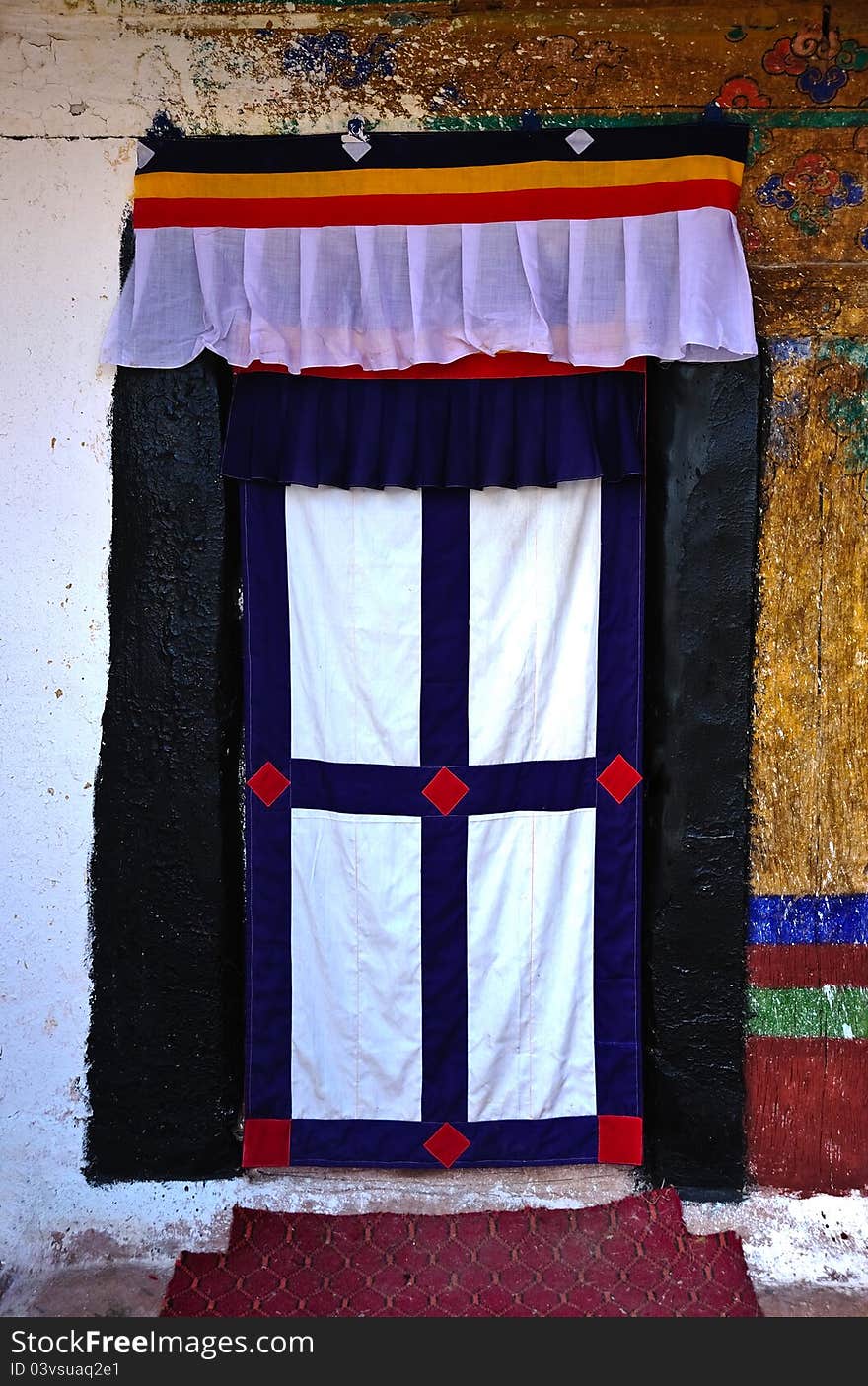 Traditional Tibetan style entrance to a house in the village of Namche Bazar in the Nepalese Himalayas. Traditional Tibetan style entrance to a house in the village of Namche Bazar in the Nepalese Himalayas