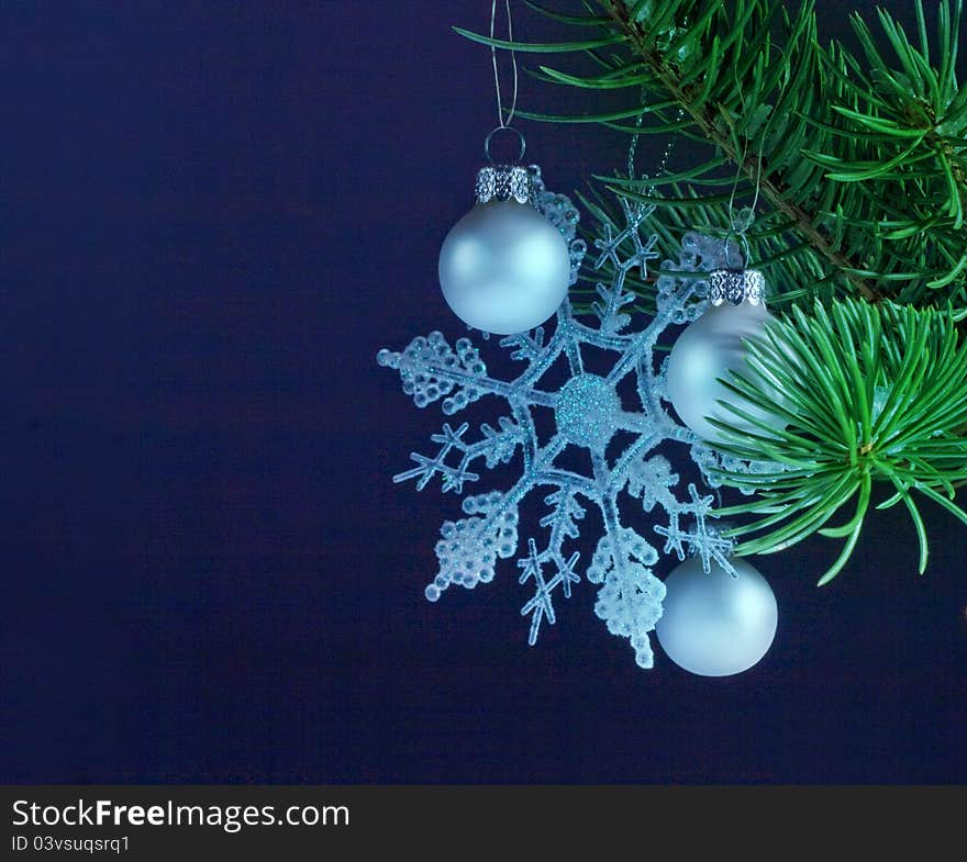 Christmas decoration with a spruce twig and silver bauble