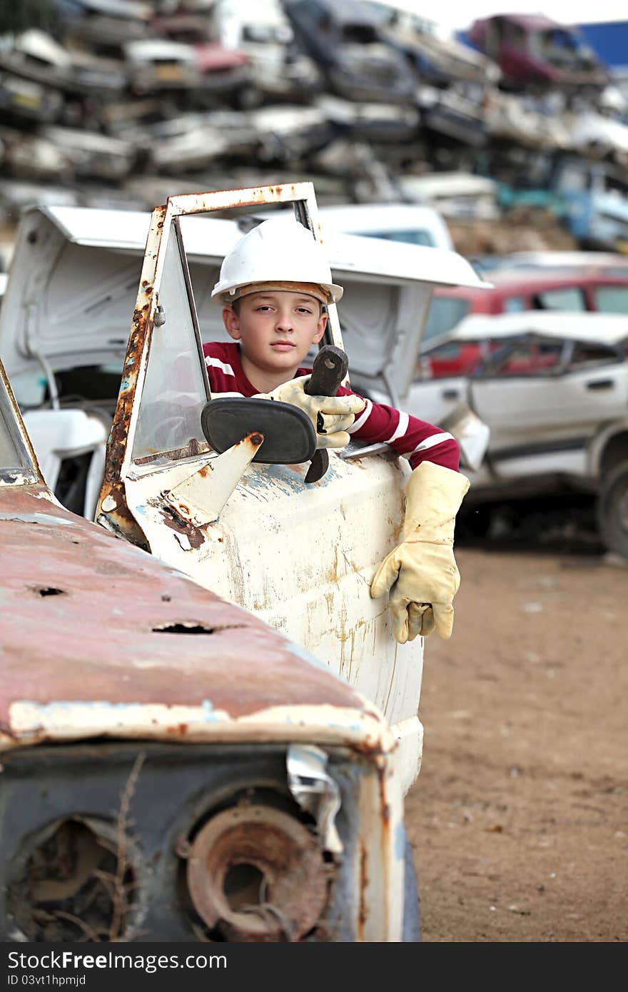 Boy at the dump cars