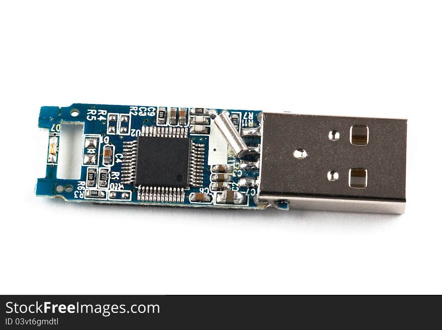 Open usb stick close up on white background. Details of the electronic part inside