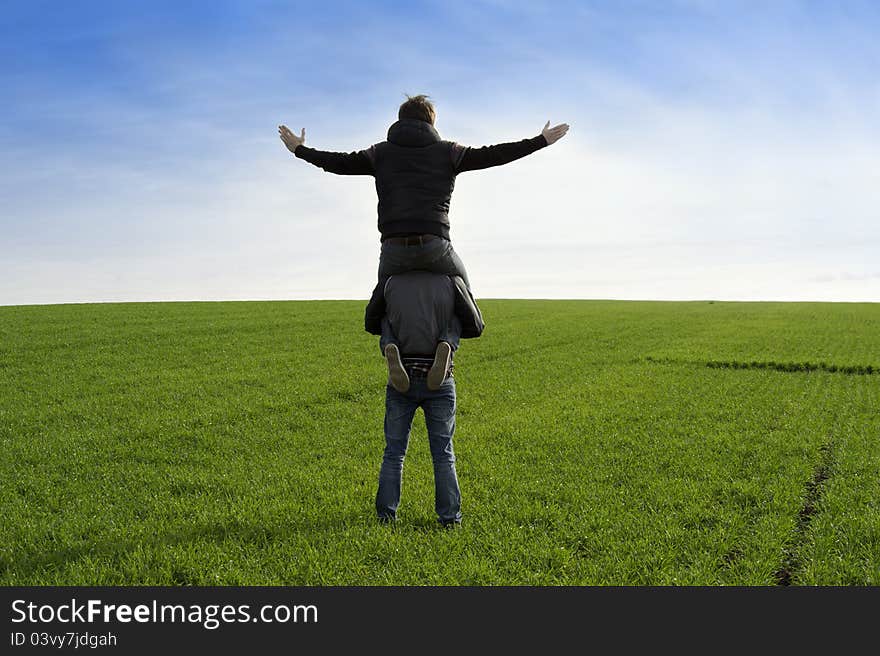 Two men looking forward on the grass field. Two men looking forward on the grass field