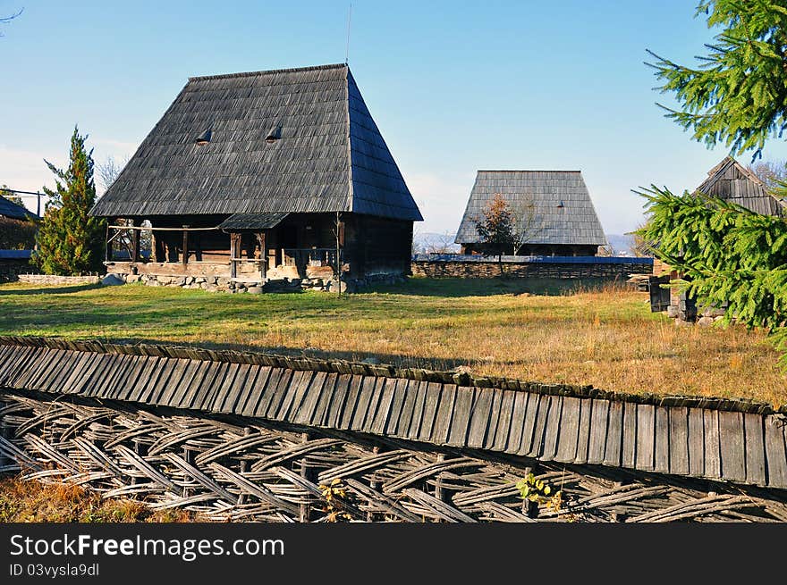 Traditional village house with wooden fence and balcony from Transylvania. Traditional village house with wooden fence and balcony from Transylvania